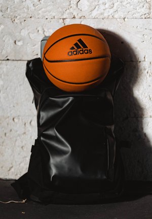 Adidas basketball on top of bag