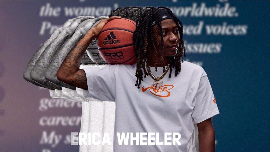 WNBA player Erica Wheeler looking away holding an Adidas basketball