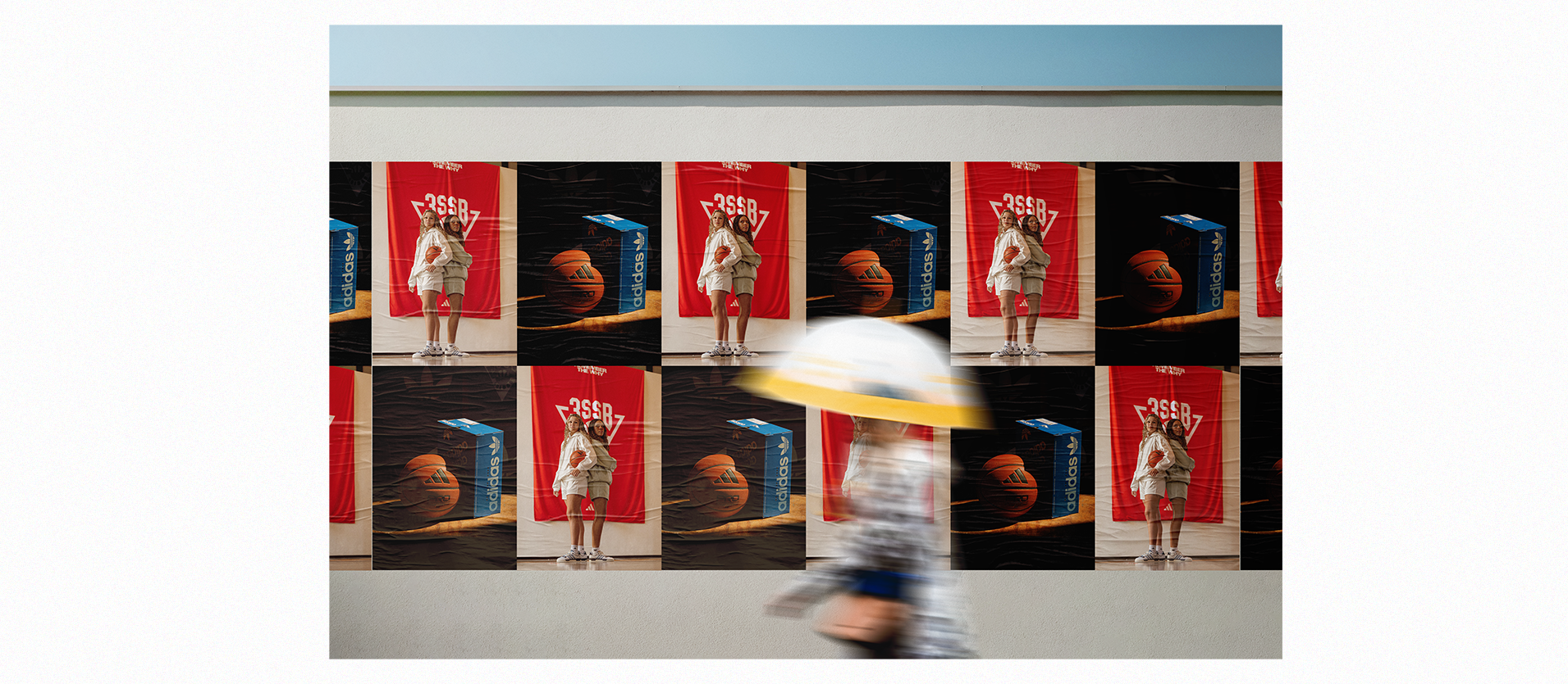 Sidewalk poster of woman posing for Adidas 3SSB